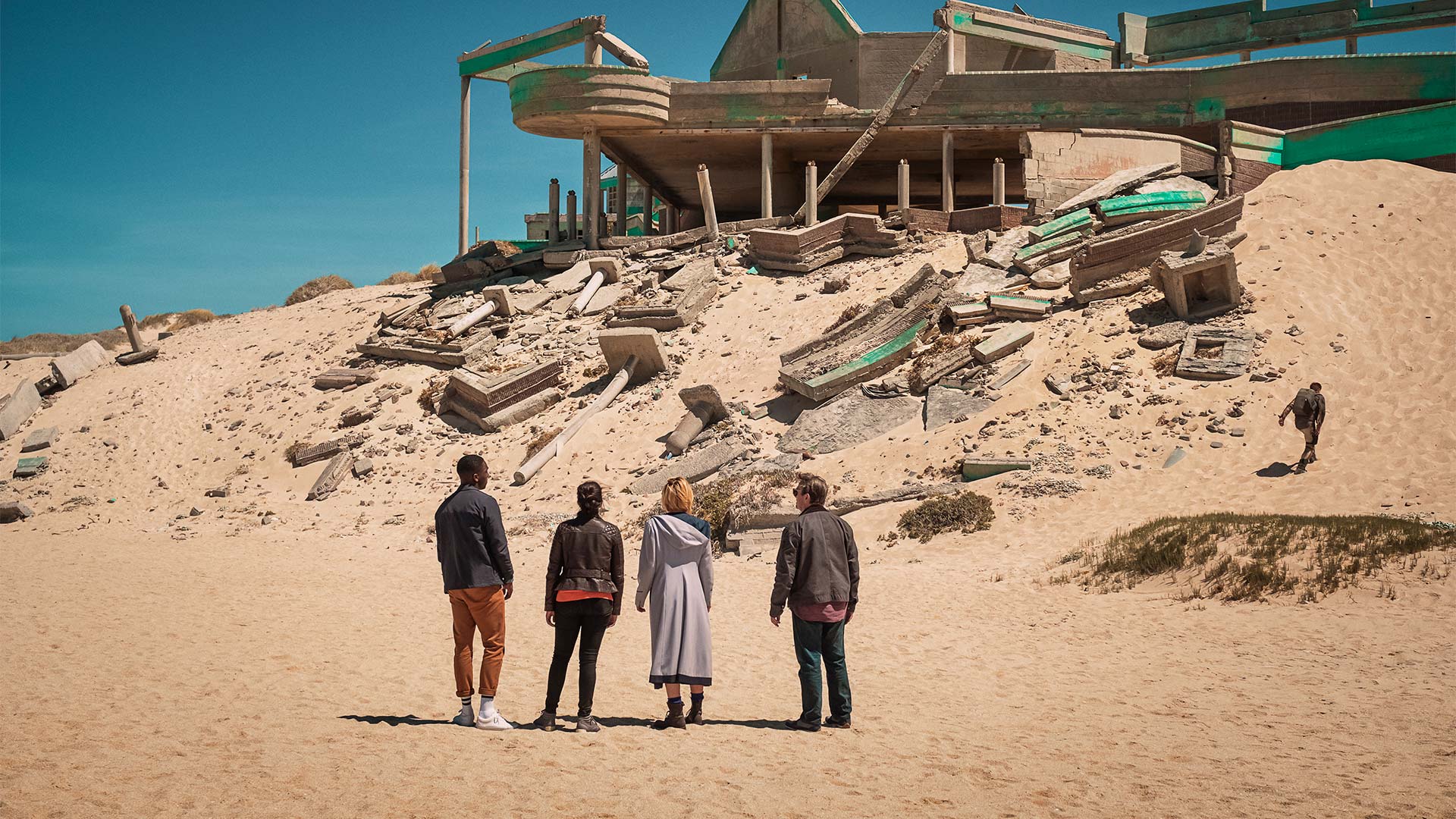 An image from The Ghost Monument, showing the Doctor, Ryan, Graham and Yaz on the brilliantly realised planet of Desolation.