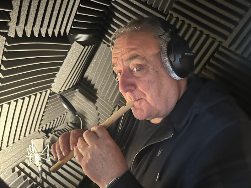 Michael Troughton plays the flute while recording for James Robert McCrimmon
