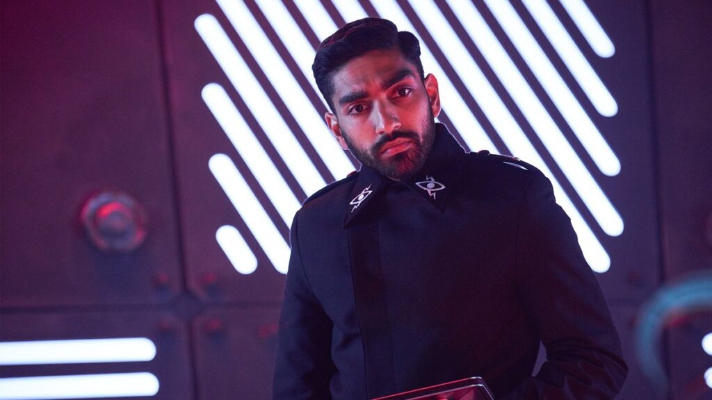 Castavillain standing in front of an interior spaceship wall, looking concerned.