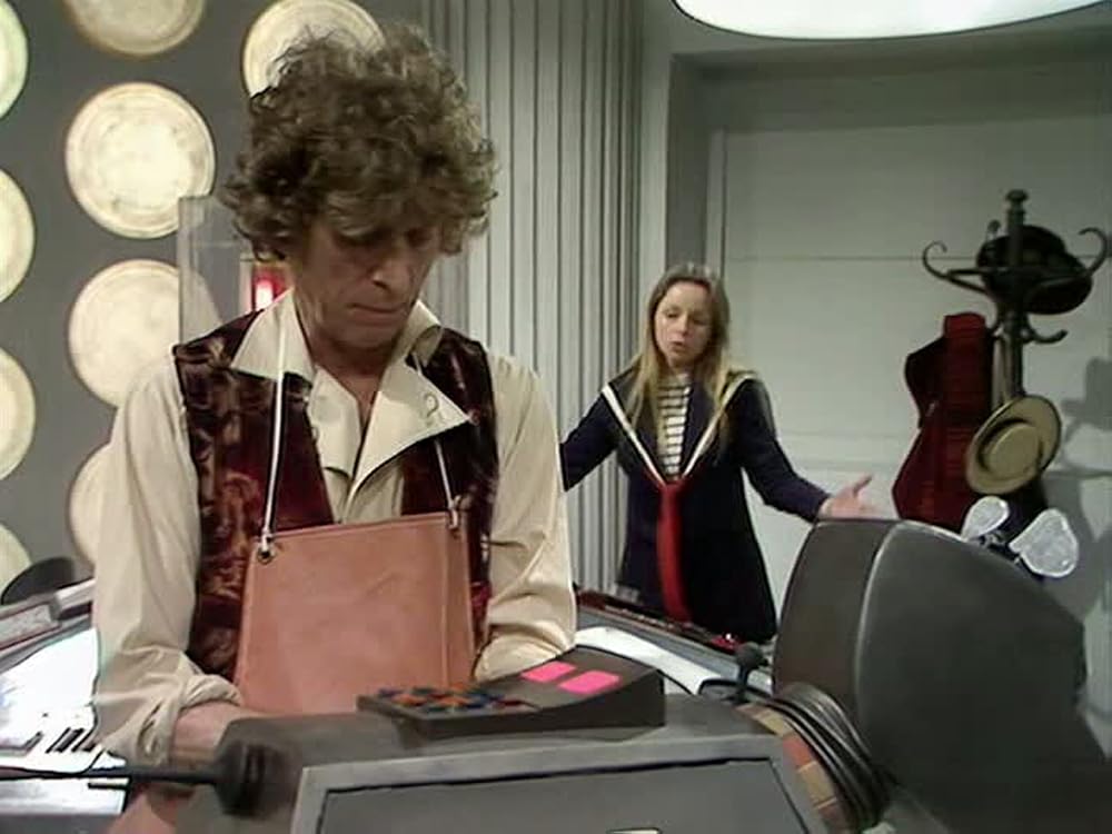 Tom Baker and Lalla Ward in the Tardis examining K9