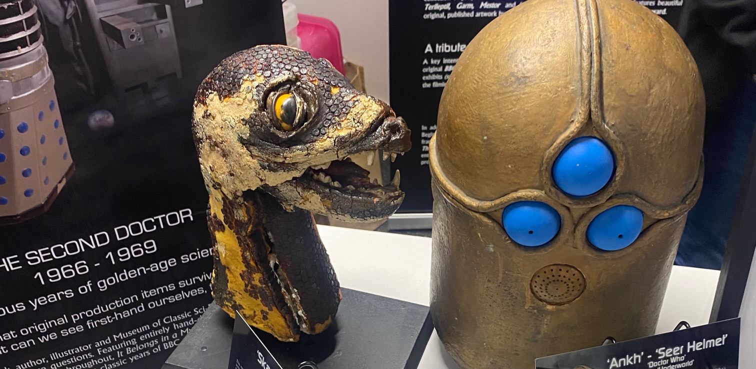 An old prop of a loch ness monster head with a large circular eye and sharp teeth