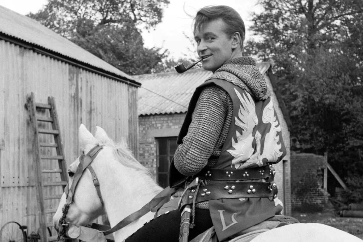 Ian, wearing armour, sat on a horse