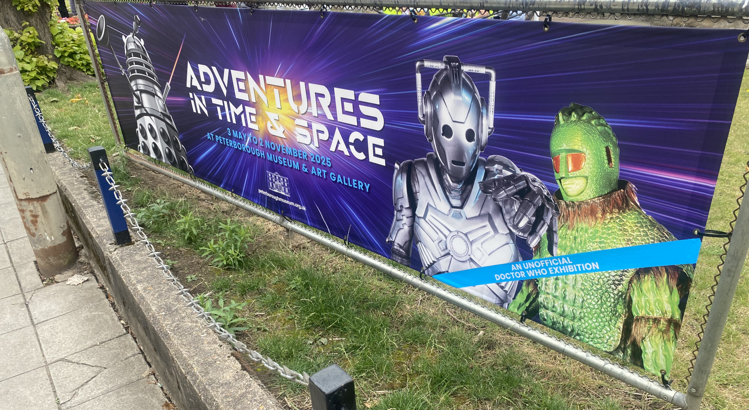 A banner promoting Adventures in Time & Space outside Peterborough Museum