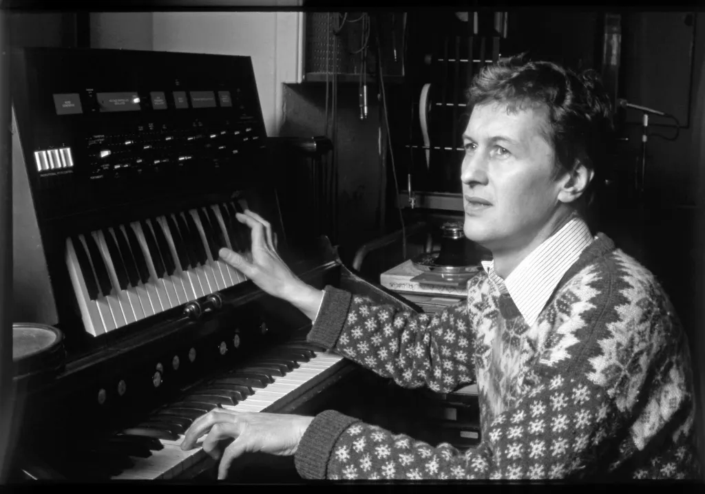 Brian Hodgson at work with some pianos