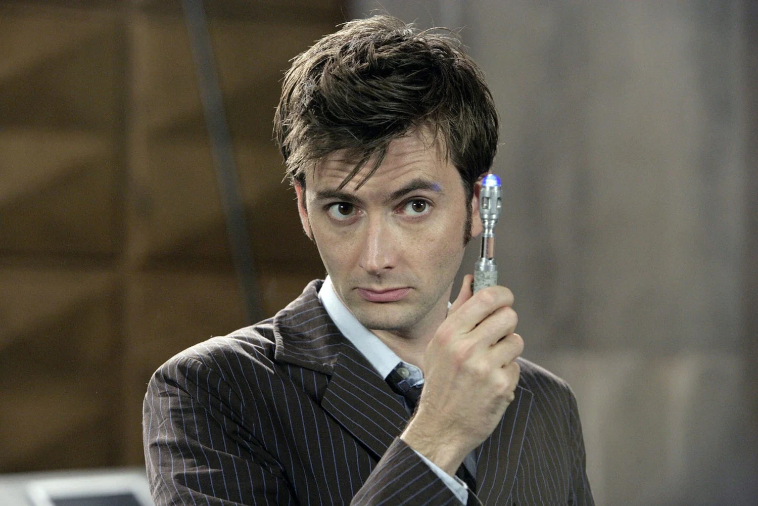 The Tenth Doctor holding a sonic screwdriver